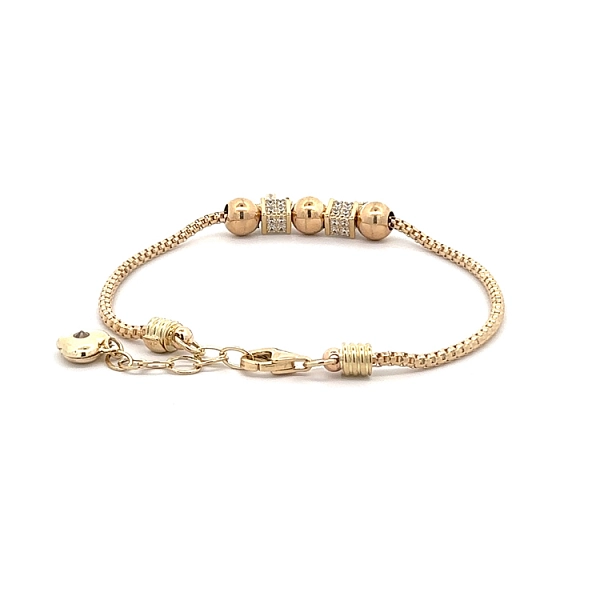 Goldarmband mit leuchtenden Steinen und Symbolik für Liebe und Glaube