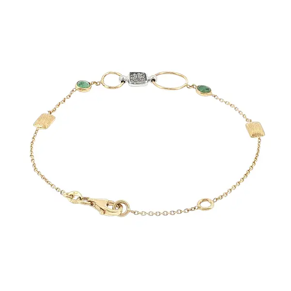Armband aus 14 Karat Gold mit grünen Steinen und Zirkonen