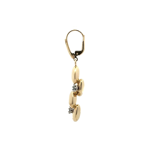 Goldene Ohrringe mit schwarzen Steinen