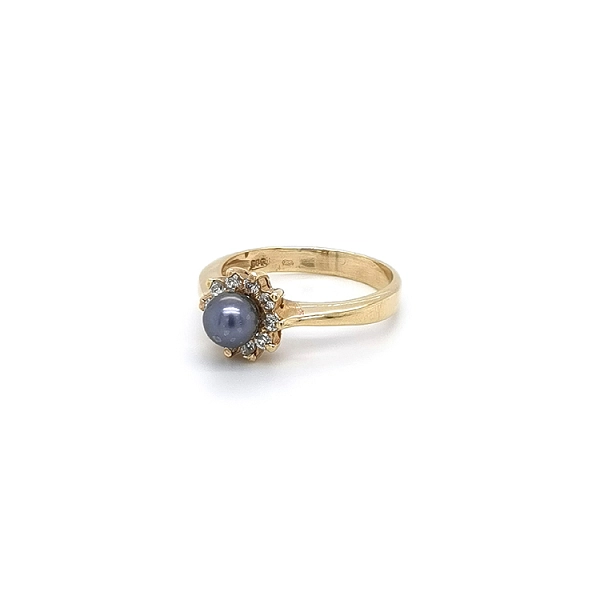 Goldring mit schwarzer Perle und Zirkonen