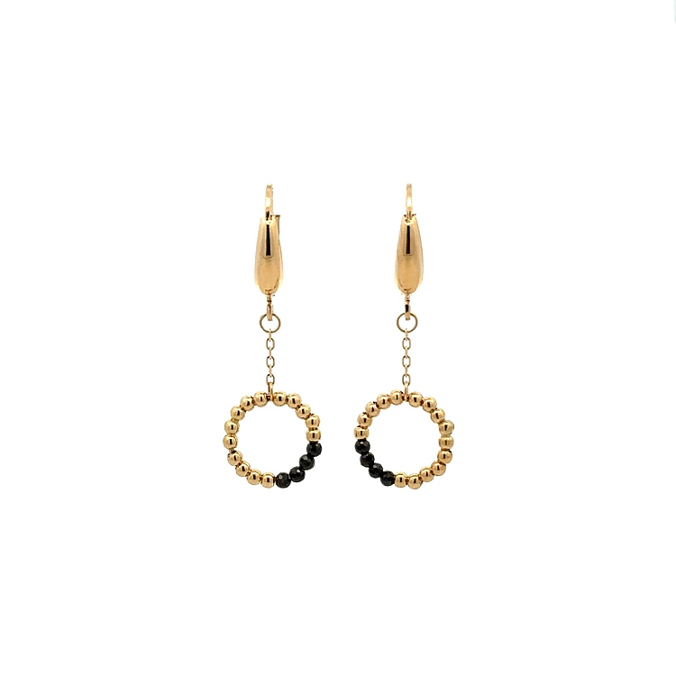 Goldene Ohrringe mit schwarzen Steinen